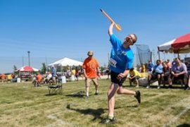 An athlete competes in the mini-javelin event.