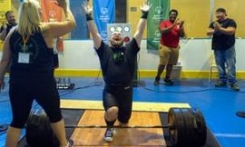 Andrew Dziezak celebrates his 450lb lift in power lifting.