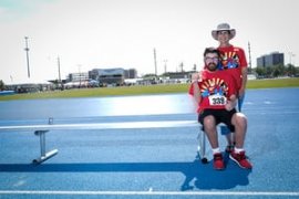 Diane Watson, right, poses for a portrait with her grandson Jordi Watson, showing off his 7th place ribbon.